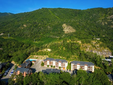 Surrounded by lush forest, this peaceful alpine escape promises pure tranquility.