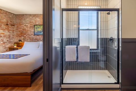 Shower, designer toiletries, bathrobes, towels