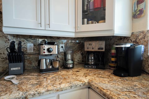 Enjoy your morning brew with a full coffee station and multiple machines.