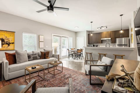 Step into the heart of the home. A warm, inviting, open layout living room bathed in natural light. 