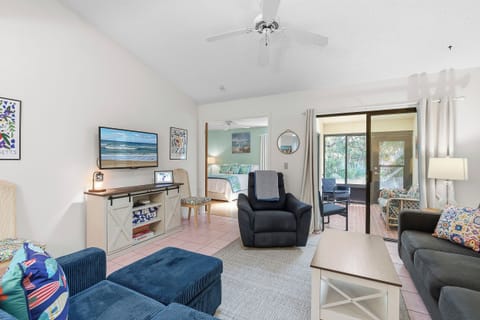 Unwind in this bright coastal living room with comfortable seating, smart TV, and sliding doors to a private patio. Just steps from the bedroom, this inviting space makes the perfect beach stay escape after a sun-soaked day by the shore.