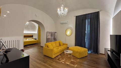 Deluxe Suite, Balcony, City View | Minibar, in-room safe, blackout drapes, soundproofing