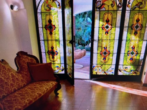 Superior Triple Room, Garden View | Living area | TV