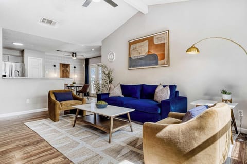 Bright, vaulted living room with plush seating and natural light; perfect for slow mornings or evening resets