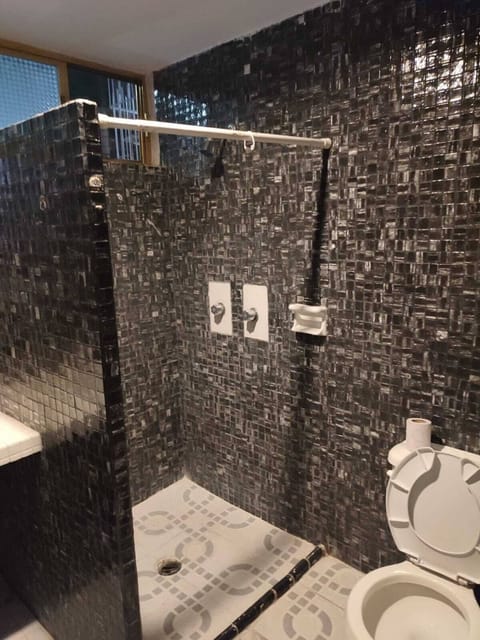 Standard Double Room | Bathroom | Shower, towels, soap, shampoo