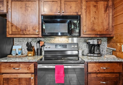 Microwave, coffee maker, and all the tools you need — plus plenty of counter space.