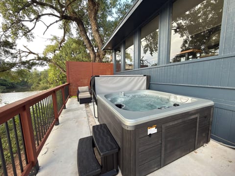 Hot tub on the deck, lake view — optional add-on, $150, prepped before arrival (fee waived on bookings over $2,000)