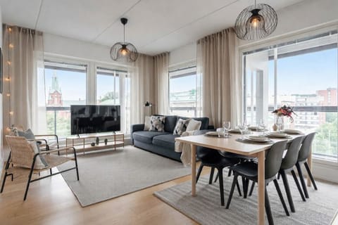 Apartment, Balcony, City View | Living area | 55-inch flat-screen TV with cable channels
