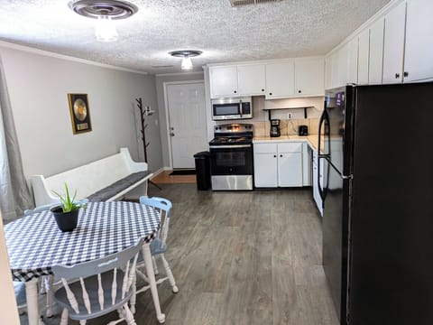 Includes fridge, microwave, stove/oven, coffee pot, toaster, cooking basics