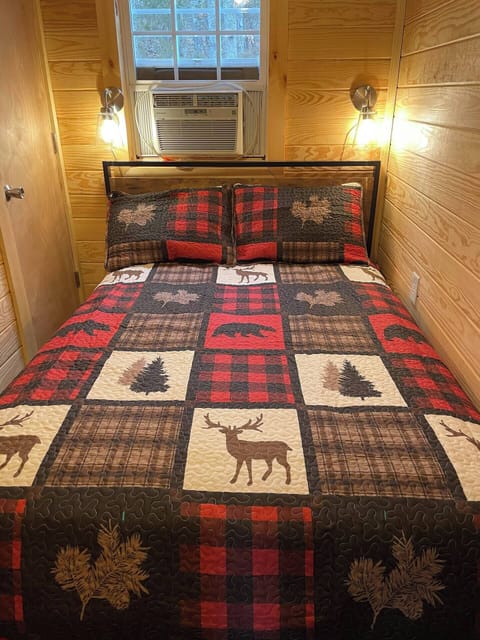 Full size bed in the cozy bedroom.