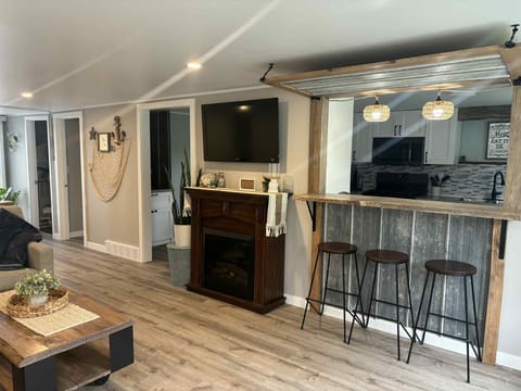 kitchen bar/pass through in living room with seating for 3