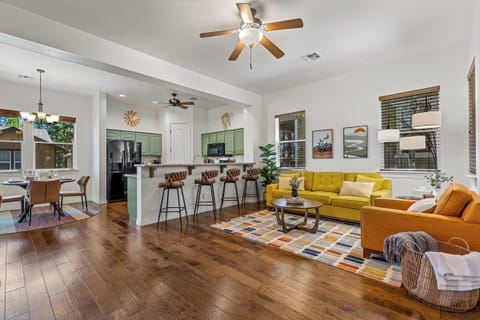 Functional open floor plan of living space, kitchen, and dining area
