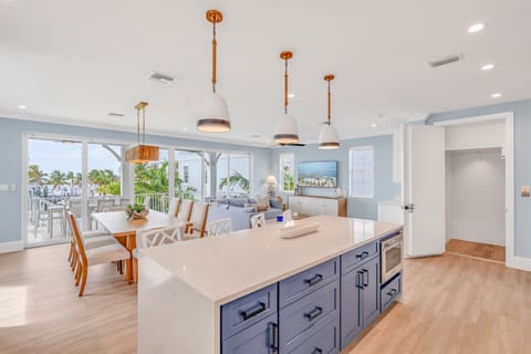 Sleek, modern, and fully equipped, this luxury kitchen is the heart of your Florida Keys vacation rental. Overlooking the water, it's ideal for entertaining, family meals, and sunset snacks after a day on the boat or by the private pool.