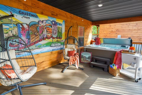 Covered and screened deck as wide as the house with a selfie spot and private hot tub!