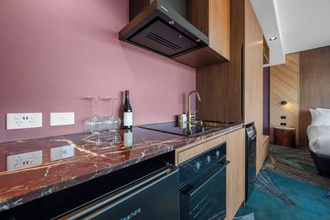 Exclusive Penthouse, City View | Private kitchenette | Highchair