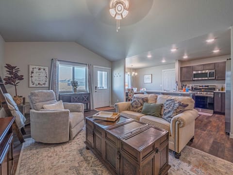 Open-concept living, kitchen, and dining area creates a spacious and inviting atmosphere for everyone to gather and relax.