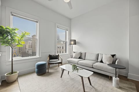 Unwind in airy comfort as daylight pours through tall windows.