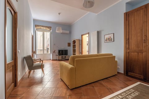 Apartment, Multiple Beds, Balcony | Living area | 30-inch TV with satellite channels