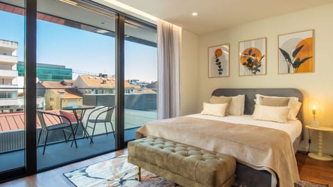 Wake up to panoramic city views in this stylish room, complete with plush bedding and vibrant wall art. #CityViewBedroom #UrbanRetreatGaia  #ModernDecorVibes