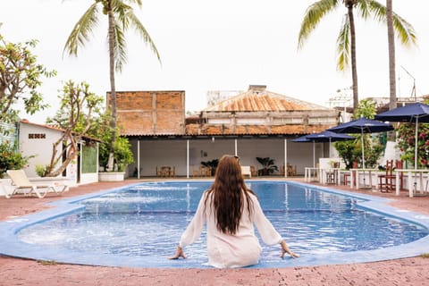 Outdoor pool, open 9:00 AM to 9:00 PM, pool umbrellas, sun loungers