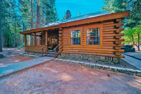 Step into the heart of Shingletown and discover this authentic log cabin, nestled among towering pines just minutes from Lassen Volcanic National Park. This warm and inviting exterior captures the timeless beauty of rustic craftsmanship. 