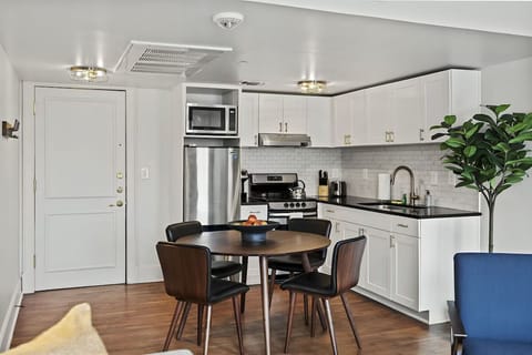 Cook comfortably with full appliances and roomy dining table.