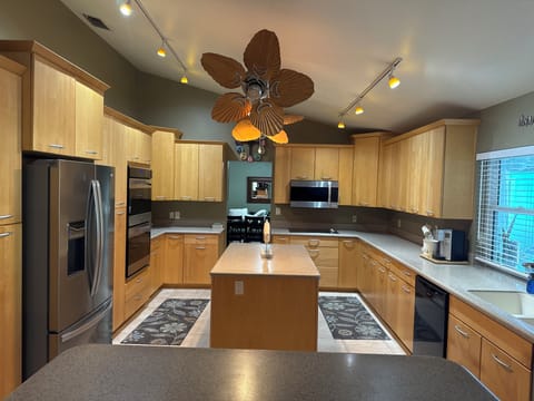 Large Kitchen for entertaining! Facing the pool too! 