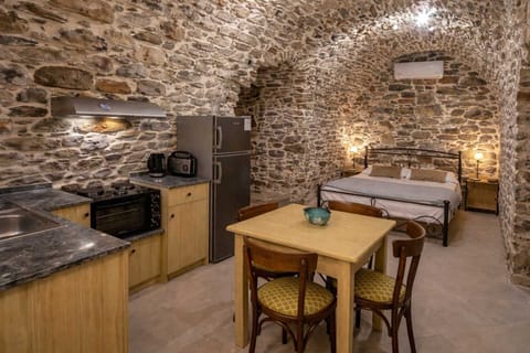 Kitchen and Dining Area with Traditional Stone Interior