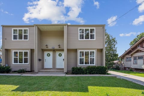 Two-story home with private entry and front lawn