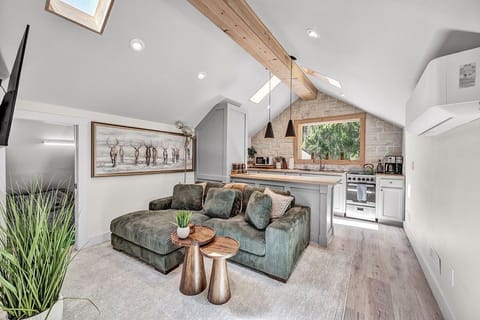 Cozy Living Room with 55-inch Smart TV, Fireplace, and bistro table.