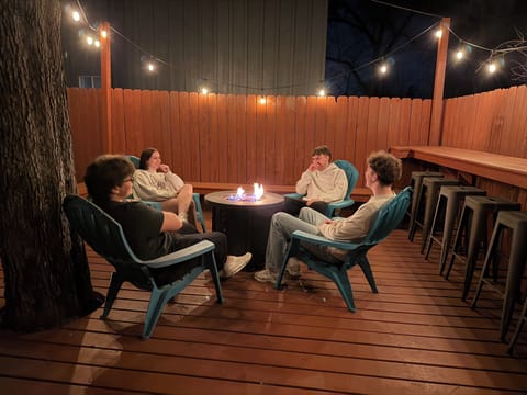 Large back deck with a gas fire pit and plenty of seating