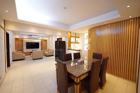 Executive Room, 1 King Bed, City View | Living area | Fireplace, printers