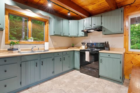 ully equipped rustic kitchen with modern comforts