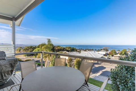 Step onto the main balcony for slow mornings with coffee, BBQ meals, and long pauses between plans.