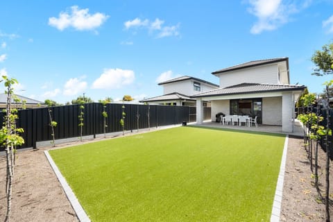 The generous backyard is perfect for outdoor entertaining, with lawn space, alfresco dining, and a Weber BBQ ready for relaxed evenings.