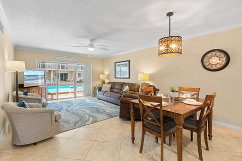 Enjoy open-concept coastal living with pool views just steps from your patio. This bright and airy space is perfect for relaxing after a beach day or gathering for meals with family and friends.