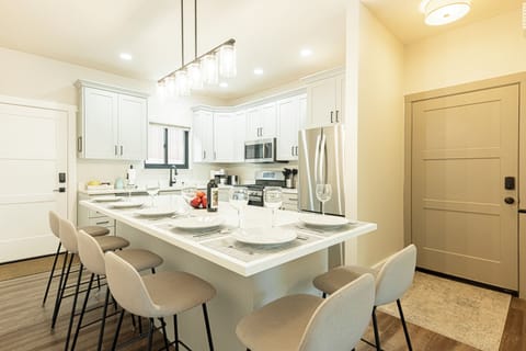 Unit 1 full kitchen with center island with seating for six