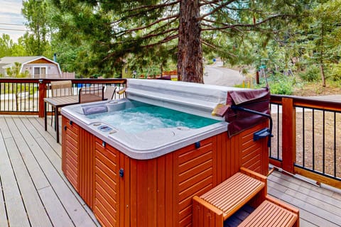Unwind in the private hot tub, perfect for relaxing after a day of adventure.”