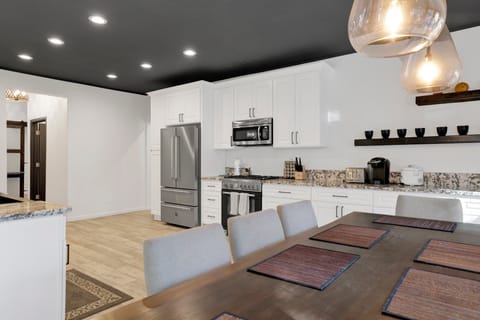 Inviting dining area designed for comfort and connection. The space feels open and airy, with a warm atmosphere that makes everyday meals and special gatherings equally enjoyable. A clean, timeless style blends effortlessly with the rest of the home, creating a cozy yet refined setting where conversations flow and memories are made.