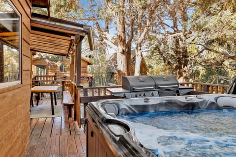 Relax in the private outdoor hot tub surrounded by peaceful forest views. After a day skiing, hiking, or exploring Big Bear Lake, unwind under the mountain sky and enjoy the ultimate cabin retreat experience.