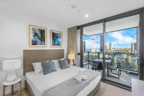 Wake up to natural light and sweeping city views from the comfort of your king bed.