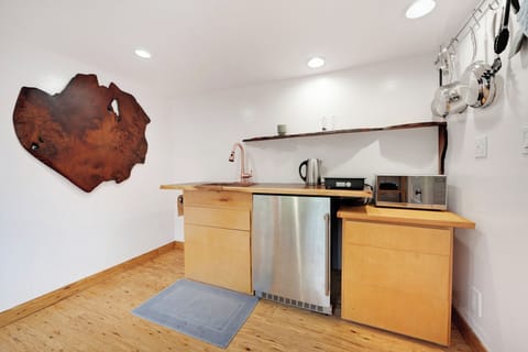 Features are high-end appliances & fixtures. Intended for light food prep