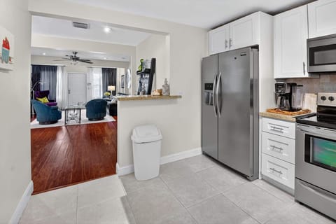 The airy kitchen offers ample space & all the comforts of home