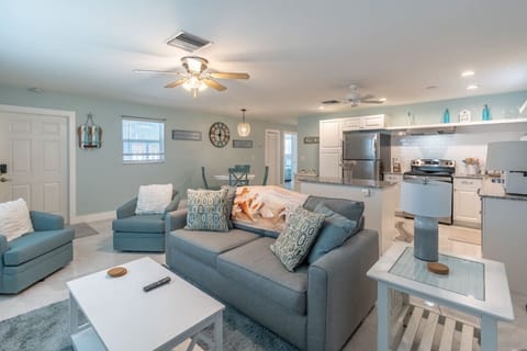 Modern living room with plush seating, elegant décor, and a well-lit space :)