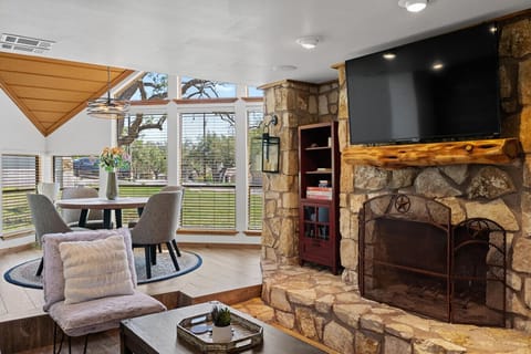Sun-filled living space with stone fireplace in Lake Travis retreat