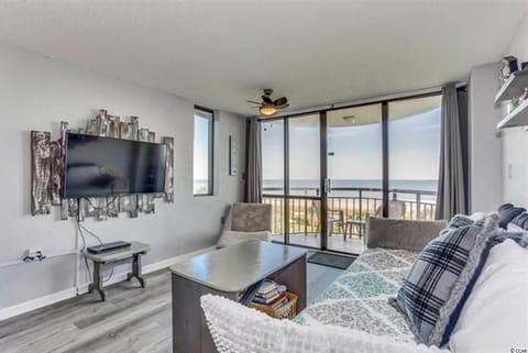 Oceanview living room with natural light and cozy seating