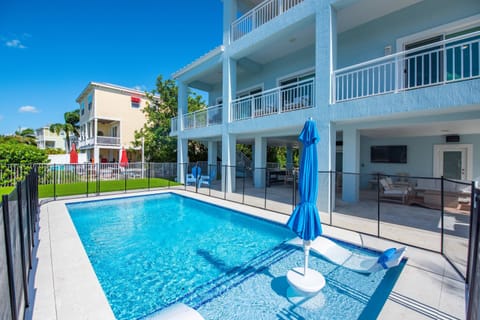 Lounge by the pool and unwind while the kids laugh and splash in the sparkling water nearby.