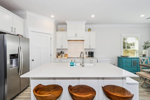 Bar seating for 3 at the oversized kitchen island