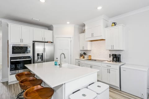 Modern kitchen with large island and walk in pantry