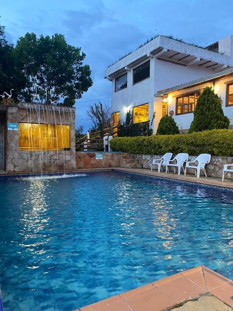 Family Quadruple Room, Pool View | Living area | TV